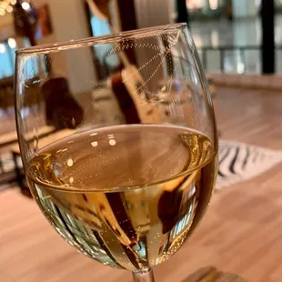 a glass of wine on a table