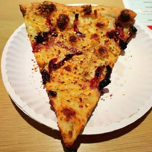 This is a 4 cheese pizza with sun-dried tomatoes. Mozzarella, parmesan, Romano and gouda.