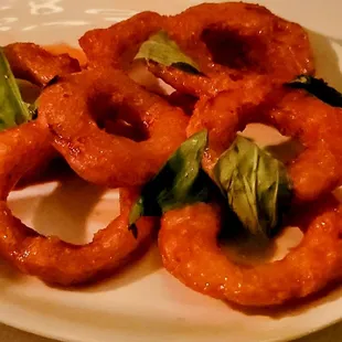 Fried squash drizzled with honey with basil