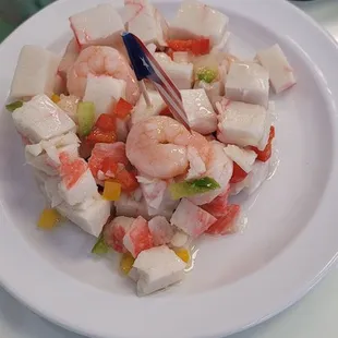 Seafood salad, chicken pastello, chicken with rice and salad