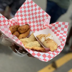 a person holding a basket of food