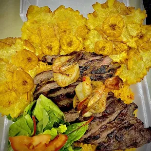 a plate of food on a styrofoam container