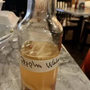 a bottle of raw enyogyce sitting on a table