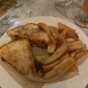 a sandwich and fries on a plate