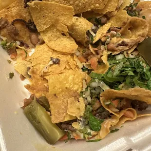 Trying to find anything edible in the nachos