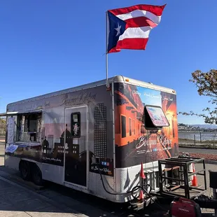 a food truck parked on the side of the road