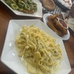 mozzarella sticks , pesto, and fettuccine alfredo