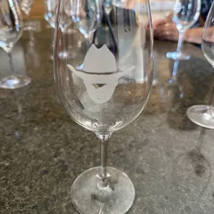 a glass of wine on a bar