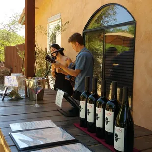 Enjoying live music and wine tasting on the patio at Borjon.