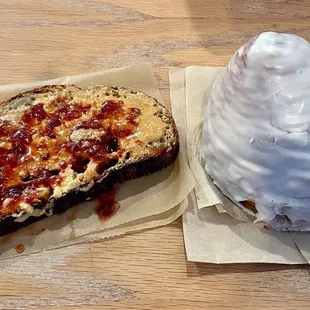 Left-Cashew butter &amp; strawberry jam toast. Right-glazed croissant.