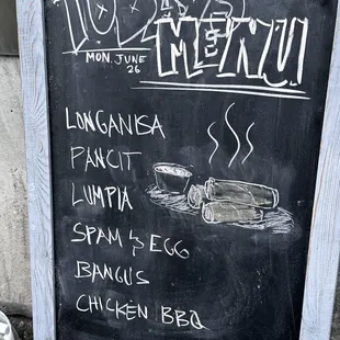 a chalk board with a menu written on it