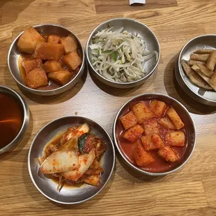 a variety of food in bowls on a table