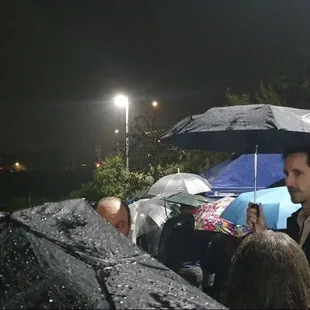 Long line in the rain.