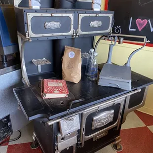 an old stove with a book on top