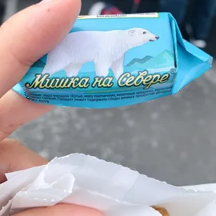 a hand holding a piece of food