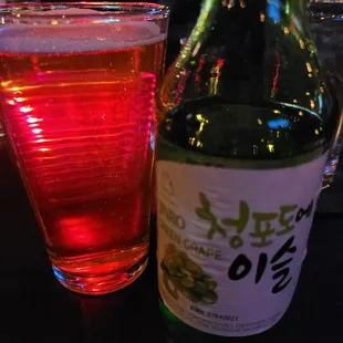 a glass of beer and a bottle