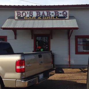 ows a truck parked in front of the building