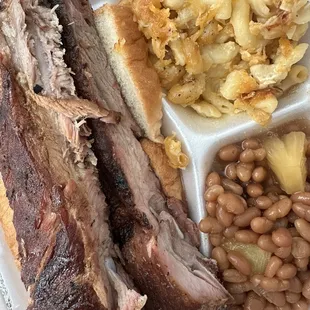 Dinner plate with ribs, baked beans and Mac and cheese