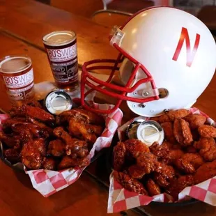a football helmet and a bowl of chicken wings
