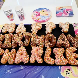 a number of doughnuts with sprinkles