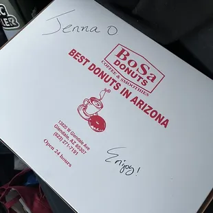 a pizza box with the best donuts in arizona written on it