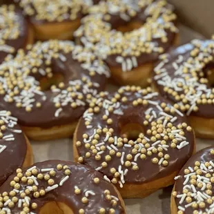 chocolate frosted donuts with sprinkles
