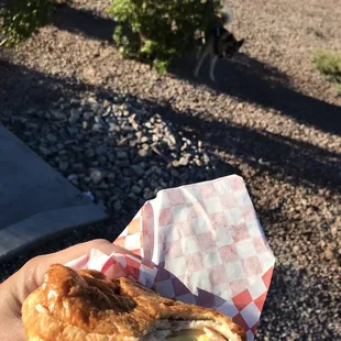 a hand holding a pastry