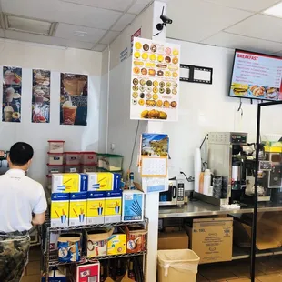 a man standing in a donut shop