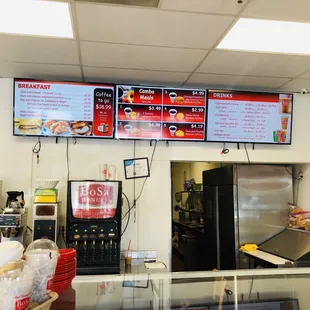 menus on the wall above the counter