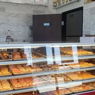 a display case with a variety of pastries