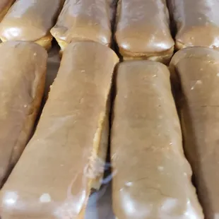 a close up of a tray of doughnuts