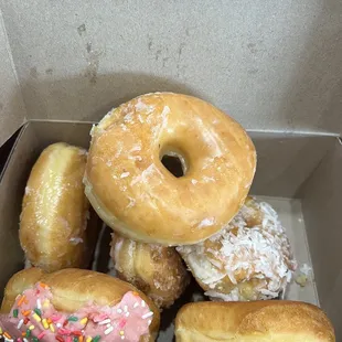 Box of yeast donuts - glazed, crumb, sprinkles and coconut