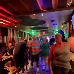 a crowd of people in a bar