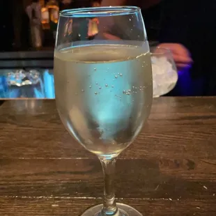 a glass of water on a bar