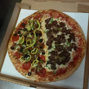 Now that&apos;s sexy pizza pie! half the works and half cheese steak with onions and green peppers!