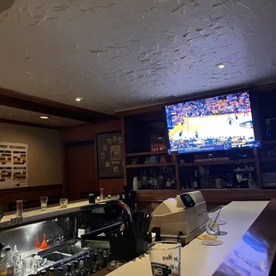 a bar with a television in the background