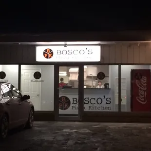 Store front and restaurant. No tables, just pick up and delivery orders. There is a bench inside for waiting.