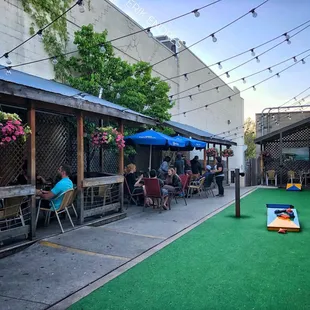 Dog friendly patio with bags, TVs and heaters.