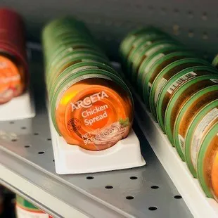 several jars of sauce on a shelf