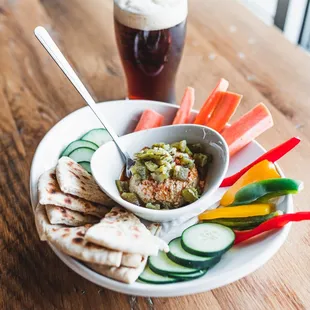a plate of pita chips and vegetables