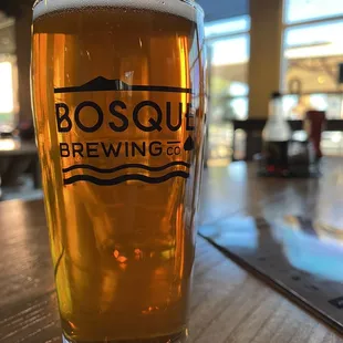 a glass of beer on a table