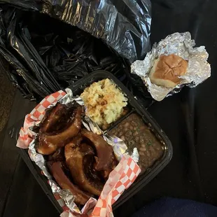 8 ribs, beans, potato salad, and a bread roll