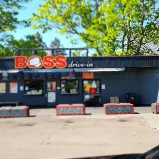 a man walking in front of a restaurant