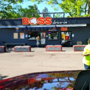 a woman standing in front of a business