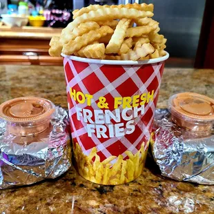 Tub of crinkle fries, 2 super singles with Boss sauce