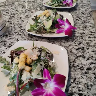 three plates of salad