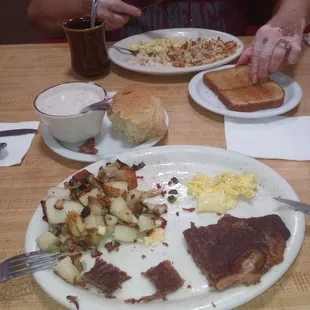 New York steak with biscuits and gravy and home style potatoes, my order Senior plate just right for her.
