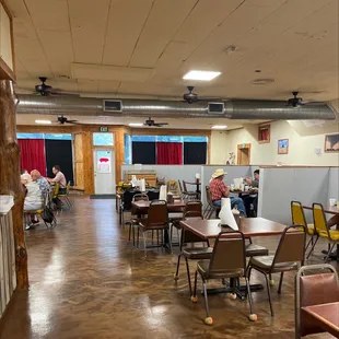 a restaurant with tables and chairs