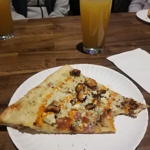 Yummy slice of pizza enjoyed with a beer at Pat's Tap next door