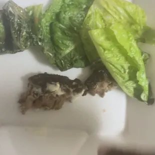 a plate of lettuce and other food items